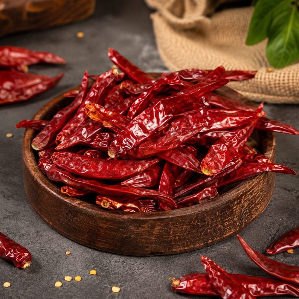 Dried red chilli in a wooden bowl